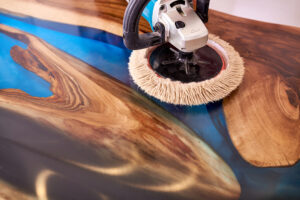 polishing machine with soft disc on epoxy table close up.