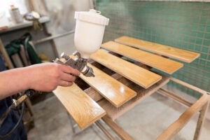 the-master-varnishes-a-wooden-board-2026-01-07-05-50-46-utc